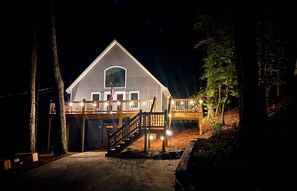Front view evenings with private driveway