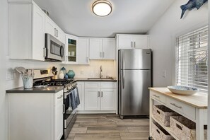 A kitchen area with modern appliances