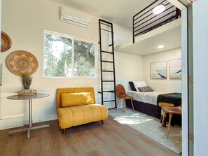 Convertible bed allows for an additional guest.