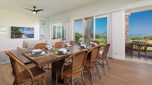 Open concept living and ding room with dining table that seats 8 guests