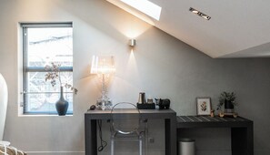 A cozy and stylish workspace with natural light, perfect for productivity or relaxation.