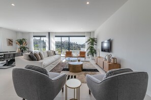 Living area with access to the terrace and views of the golf course.