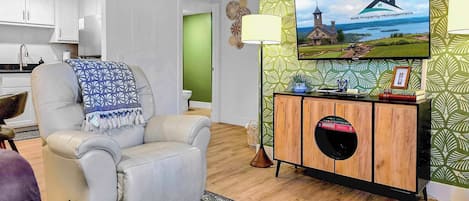 Comfy, beautiful living room with stylish, fun decor. Sit back in your sweet recliner and just enjoy the day.
