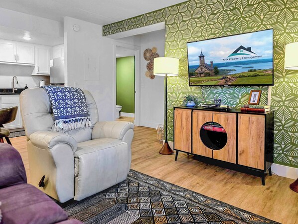 Comfy, beautiful living room with stylish, fun decor.  Sit back in your sweet recliner and just enjoy the day.