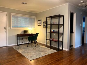 Front entry with keypad lock, work space, board & card games