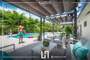 Dive into tranquility – a stunning home with lush greenery and a sparkling pool.