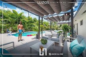 Dive into tranquility – a stunning home with lush greenery and a sparkling pool.