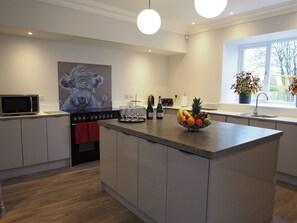 Full kitchen , American style  fridge, 84 bottle wine cooler, central  island