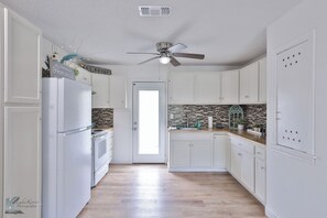 Spacious well equipped kitchen, with everything you need to prepare your meals.
