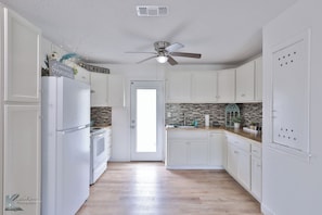 Spacious well equipped kitchen, with everything you need to prepare your meals.