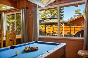 Pool table located on the main floor off the living room space.