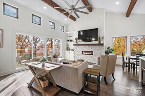Large smart TV for streaming & a modern fireplace to cozy up next to!