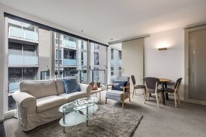  A sofa and armchair in the living area offer a relaxed setting to unwind with some TV, while portable fans and radiator wall heating help to keep you comfortable year-round.   
