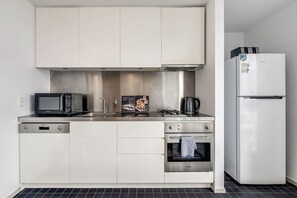 When you’re not cafe-hopping, you’ll find all you need in the modern, streamlined kitchen to prepare meals and a dishwasher for easy clean-up.  
