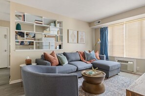 Kick your feet up and make yourself at home in our cozy living room. Couch pulls out to a queen bed to accommodate 2 extra guests.