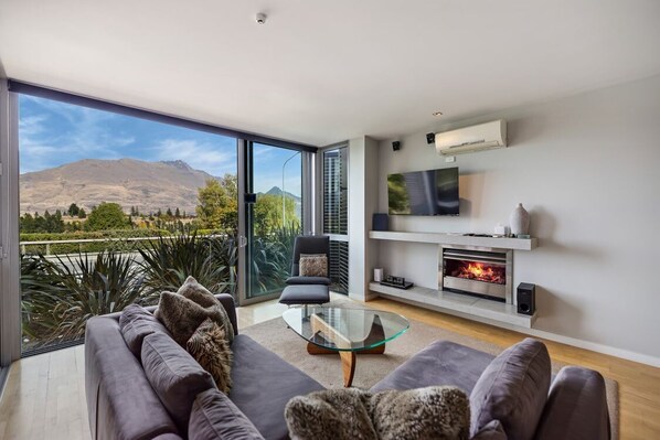 Gorgeous living room with mountain and lake views
