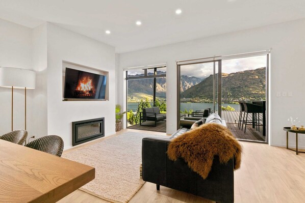 Contemporary comfort with panoramic lake and mountain views — unwind in style at your Queenstown retreat.