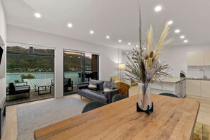 Stylish open-plan living with breathtaking lake views and natural light throughout.
