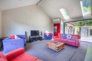 Large living area with plenty of space and outdoor access.