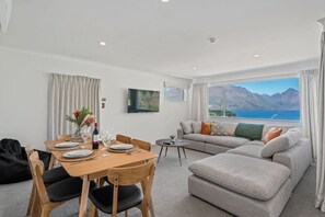 Large open plan living and dining areas with a huge picture window showing heart-stopping views!