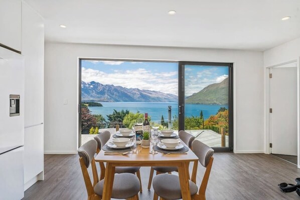 Enjoy spectacular views of Lake Wakatipu and the Remarkables Mountain Range from every room in the house.

The house features a very spacious open plan living, dining and kitchen area, flanked by the two bedrooms, each with it's own ensuite.