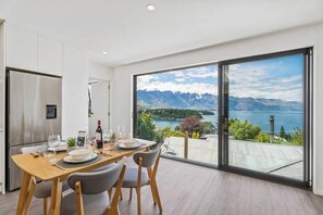 Enjoy fantastic views from the spacious open plan living and dining room.

Please note:  There is no external balcony.  You can open the  sliding doors up wide, but there is a glass panel stopping you from stepping out.