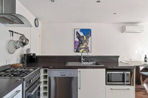 The large kitchen features all modern appliances and gas cooking.