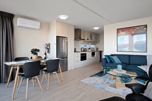 The apartment is cosy, yet quite spacious, with lots of heating and cooling options... heat pump (air con), oil heaters,  and fans,