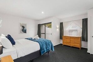 Large bedroom with plenty of space.   Enjoy the comfy large queen size bed and outside patio balcony.