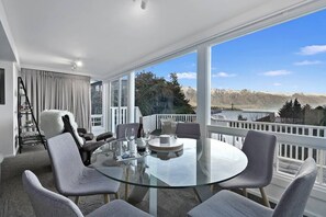 Enjoy the beautiful dining room table while you gaze out over the stunning views of the Remarkable Mountains and Lake Wakatipu.
