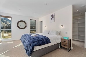A beautiful big king size bed awaits you in the huge master bedroom, featuring large walk in closet and private ensuite.

Enjoy the fantastic views of the mountains and the Shotover river while you soak up the fabulous year round sunshine.