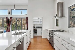 Enjoy the massive and very well presented kitchen.

There's a separate butler's pantry, complete with all the things you'd expect in a luxury kitchen.