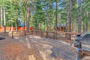 Exterior: Spacious back deck, gas BBQ, wooded backyard