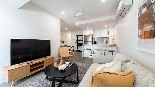 Living area with smart tv, air conditioning.  It's such a gorgeous space 