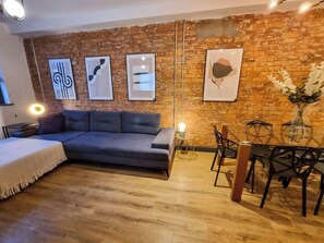 Make yourself at home! Our comfy sofa and warm lighting create a relaxing space you won’t want to leave.