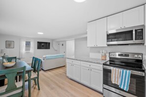 Spacious open living, dining and kitchen area.
