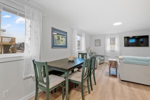 Bright natural light fills the dining and living space.
