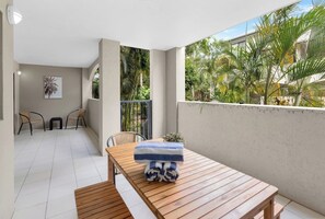 Dine outdoors on the patio, soaking up the balmy weather and tropical vibe.

