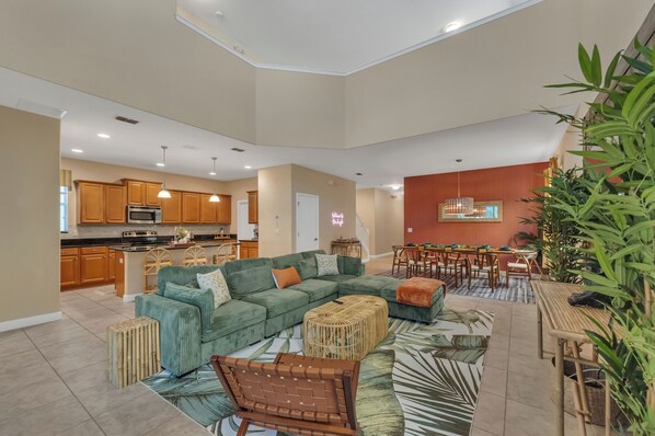 Living room in an open floor plan concept with the kitchen and dining area +