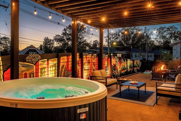 Private entertaining yard with hot tub fire pit