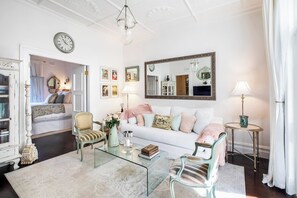 Relax in the elegantly designed living room, filled with natural light and classic décor.
