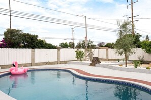 Chill vibes only 🌴☀️ Enjoy the backyard view of our sparkling pool, perfect for lounging and soaking up the California sunshine.