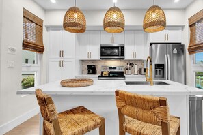 You can brew your morning cup of joe or fix a quick bite in this modern kitchen.