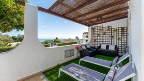 Relax on the shaded patio with panoramic sea views #AlgarveViews #BeachLiving