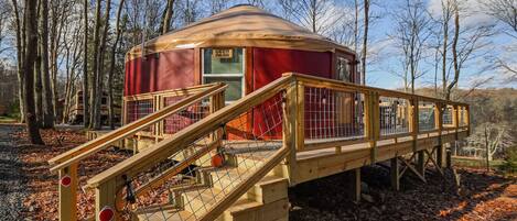 Step outside to your private outdoor oasis featuring a cozy deck, grill, and shaded seating area. Relax by the fire pit with free firewood provided. This peaceful retreat offers the perfect blend of comfort and adventure.