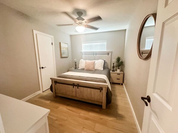 Bedroom 2 with queen bed, smart TV, and closet