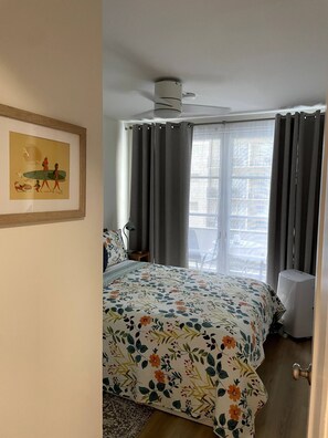 Bedroom separated by door and solid wall