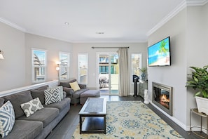 Curl up in the breezy living room & enjoy a fireside movie night at home!