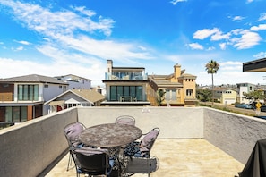 Lounge the day away with partial ocean views on the rooftop deck!