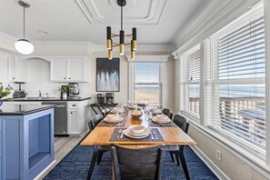 Dine in style with a view! The dining area offers comfortable seating for family meals or intimate gatherings.